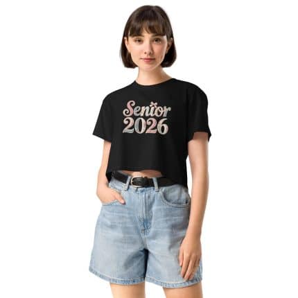 Senior 2026 women's crop top in soft combed cotton, relaxed fit with dropped shoulders, cropped length, and ribbed crew neck.